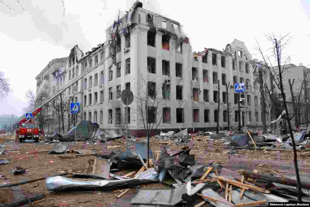 UKRAINE - Firefighters work to extinguish a fire at the Kharkiv National University building, which city officials said was damaged by recent shelling, in Kharkiv, Ukraine March 2, 2022