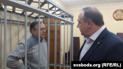 Падсудны Андрэй Галавач і ягоны адвакат Аляксей Швакаў