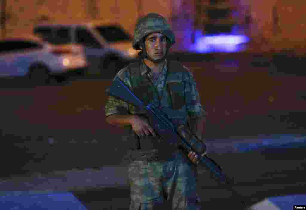 A Turkish military stands guard near the Taksim Square in Istanbul, Turkey, July 15, 2016. REUTERS/Murad Sezer