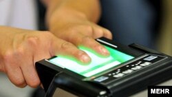 Iran -- a man tests Fingerprint Identification System .UNDATED