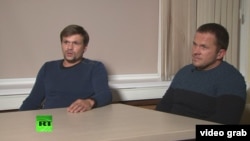 Russia - Two men identified as Aleksandr Petrov and Ruslan Boshirov appeared on Russia Today (RT) to discuss charges in Britain that they were involved in Novichok poisoning - screen grab